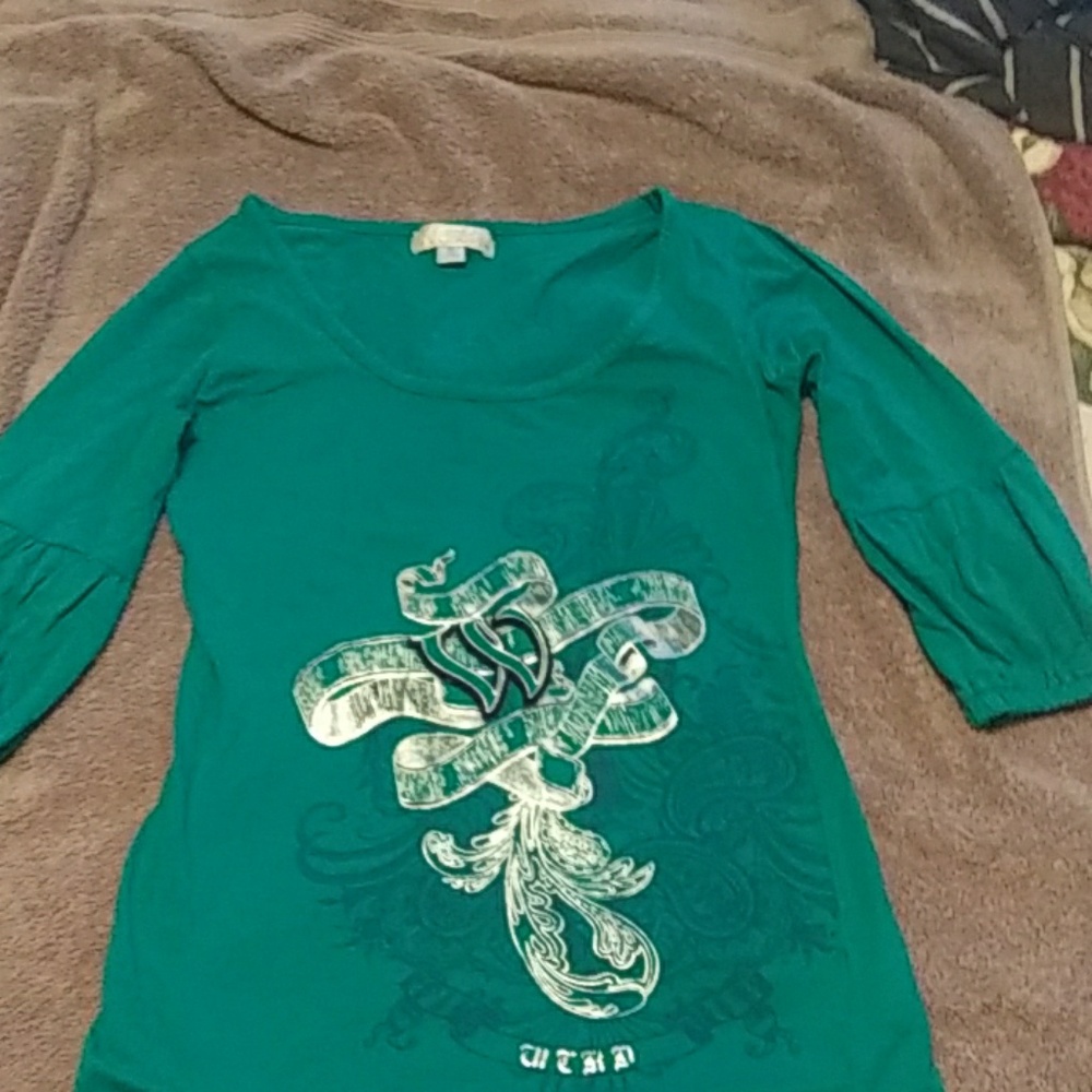A small turquoise  half sleeve shirt